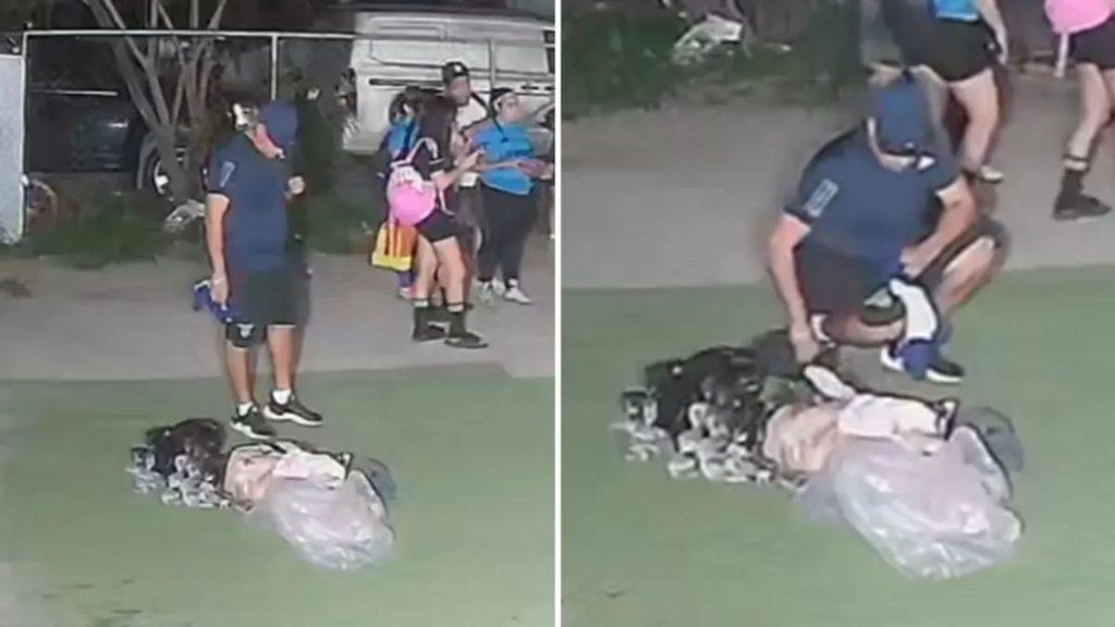 Split-screen Surveillance Frame: a Man in a Blue Shirt and Cap Stands Near a Pile of Bags on a Lawn, with a Covered Body Visible on the Ground and Bystanders in the Background. | Nl Urbano