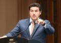 Gobernador-samuel-garcia-sepulveda- | Nl Urbano a Man in a Blue Suit at a Podium, Speaking into Microphones and Gesturing with His Right Hand. | Nl Urbano
